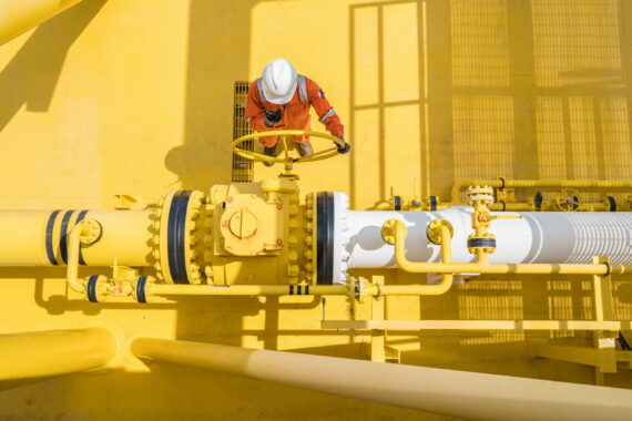 Production operator communicate between central control room by using radio to operate ball valve at offshore oil and gas processing platform for control gases and liquid crude oil process.